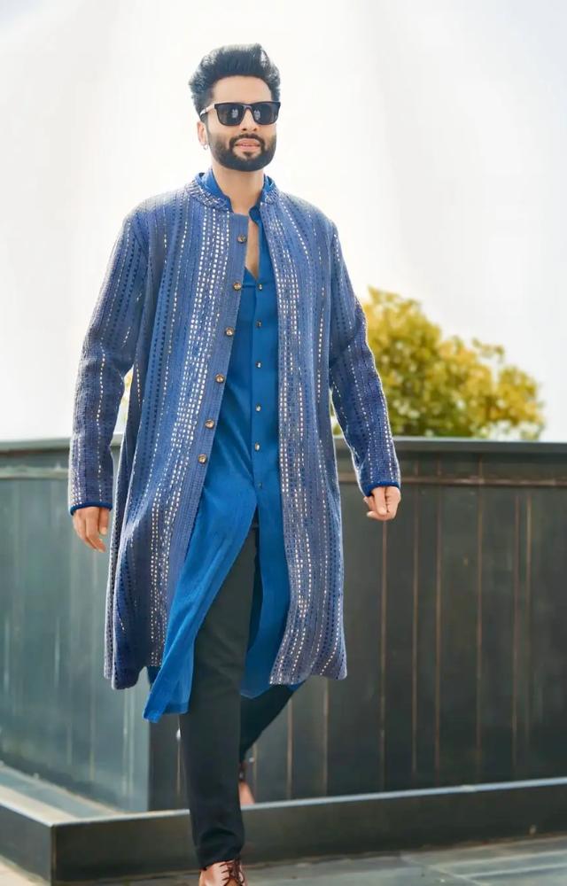 In a refreshing ensemble, Jackky opted for a blue kurta paired with a matching overcoat featuring shiny mirror work
