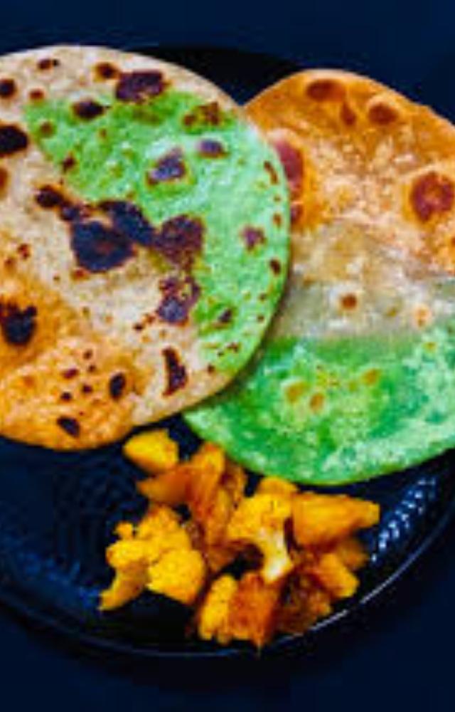 A visually appealing dish made with three different colored doughs layered together to create a tricolor effect. Serve with yogurt or pickles.