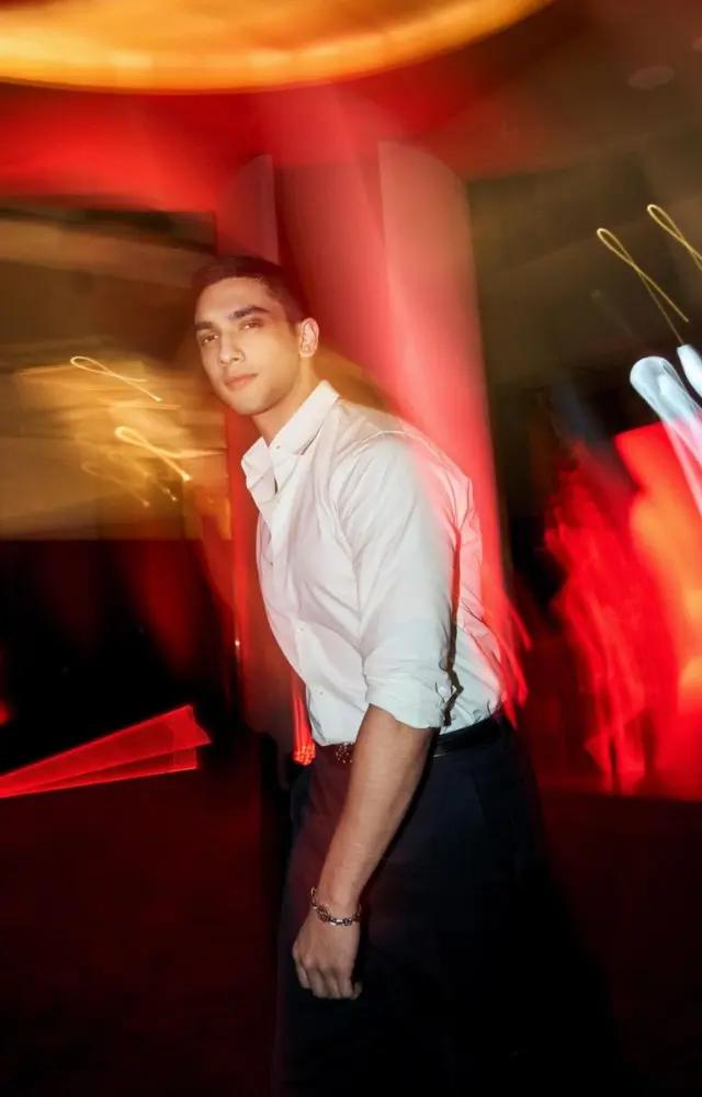 Vedang takes the classic white shirt to another level by rolling up the sleeves and pairing it with black pants