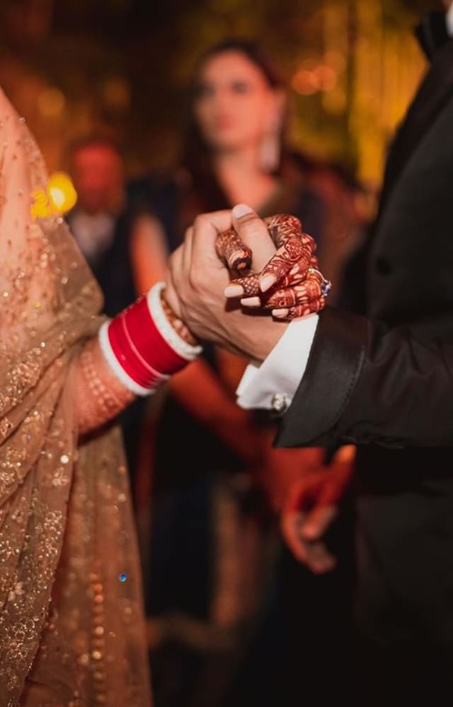 Vicky also shared an unseen picture from their wedding. It was the couple holding hands as Katrina could be spotted wearing traditional chudas.