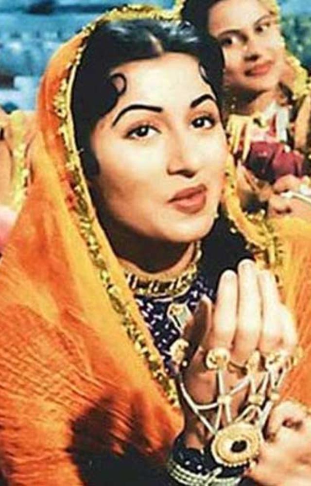 Her ethereal Anarkali look in this epic historical drama redefined Indian bridal wear. Her heavily embellished, floor-length Anarkali became a timeless classic.