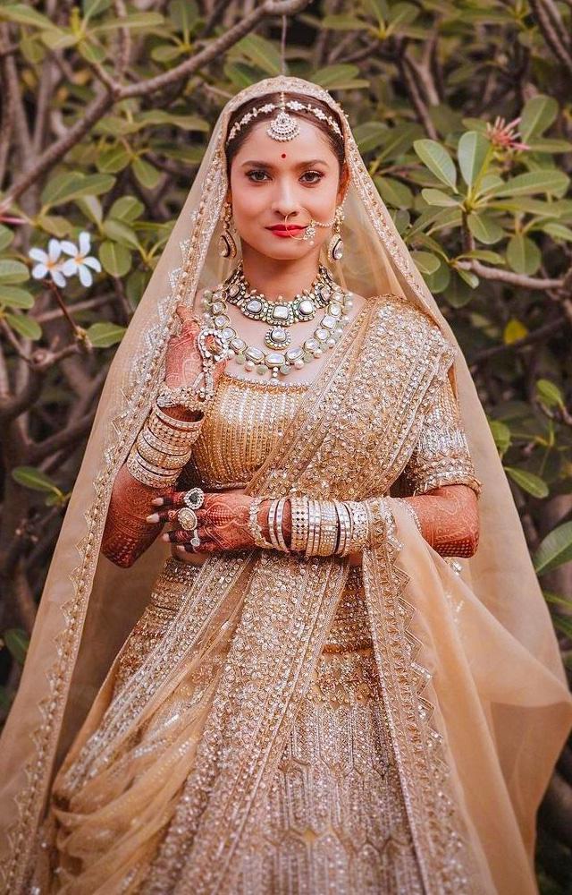 Ankita Lokhande weaves magic on her wedding day in Manish Malhotra`s enchanting bridal ensembles, a true spectacle.