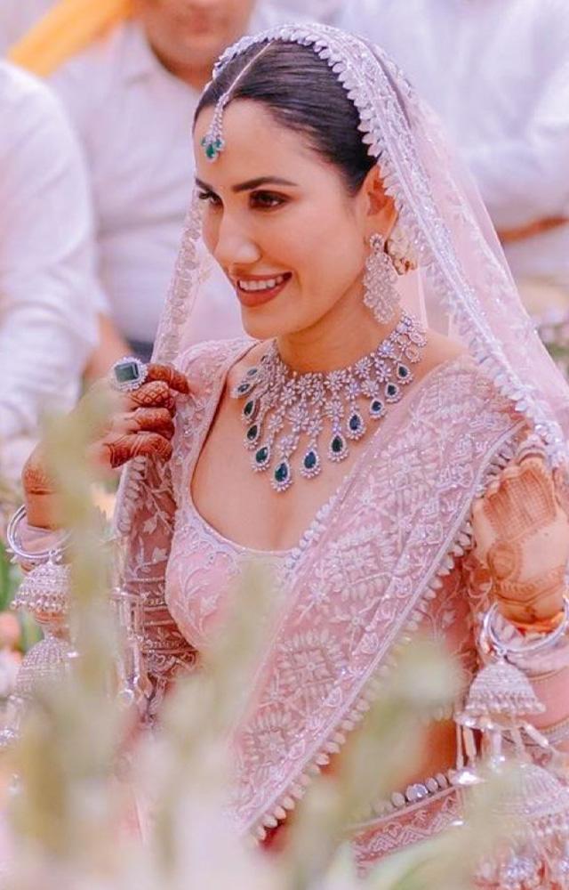 Sonnalli Seygall epitomizes bridal elegance in Manish Malhotra`s creations, showcasing timeless beauty on her big day.