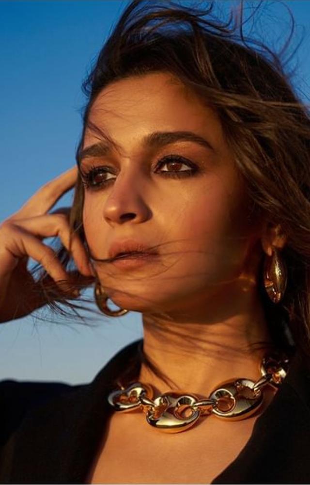 Discover Alia`s laid-back yet glamorous style as she rocks a black blazer with an easygoing charm, redefining casual elegance.