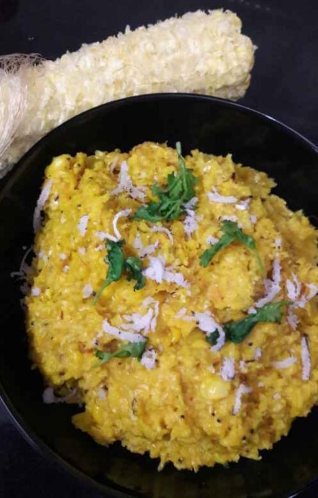 A beloved Indore street snack, perfect for monsoons, features grated corn tempered and cooked, topped with lemon coriander,coconut,essential spice mix Jeeravan