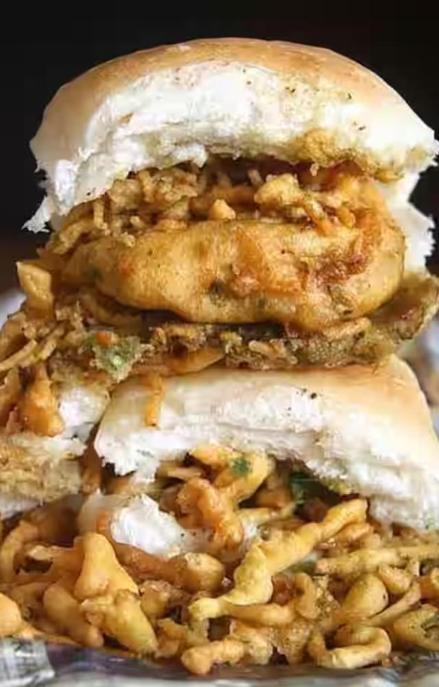 The first vada pav stand outside Dadar railway station is said to have been established in 1966 by Ashok Vaidya. Now, his son, Narendra Vaidya, happily runs it.