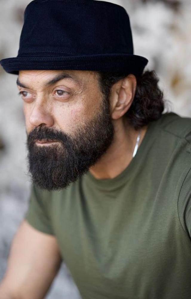 Bobby Deol has a remarkable beard that gives his captivating appearance a rustic charm. a look that epitomises charm and assurance.
