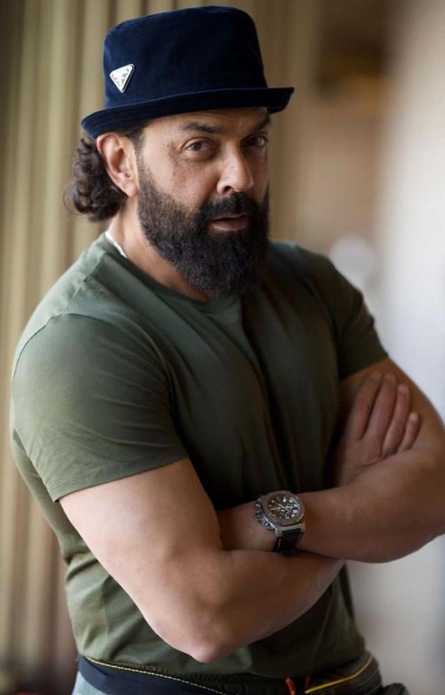 The focus is drawn to Bobby Deol`s fashion-forward beard, a classic hairstyle that radiates unmatched coolness and everlasting charm.