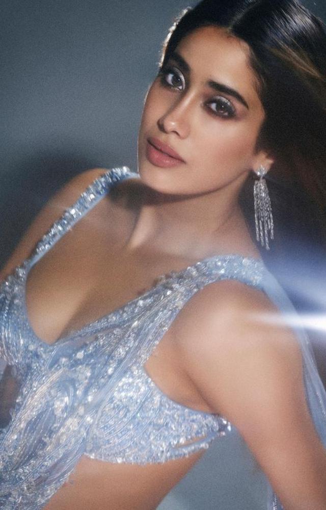 Witness Janhvi`s radiant charm as she graces the spotlight, redefining elegance in a captivating blue saree. Fashion at its finest!