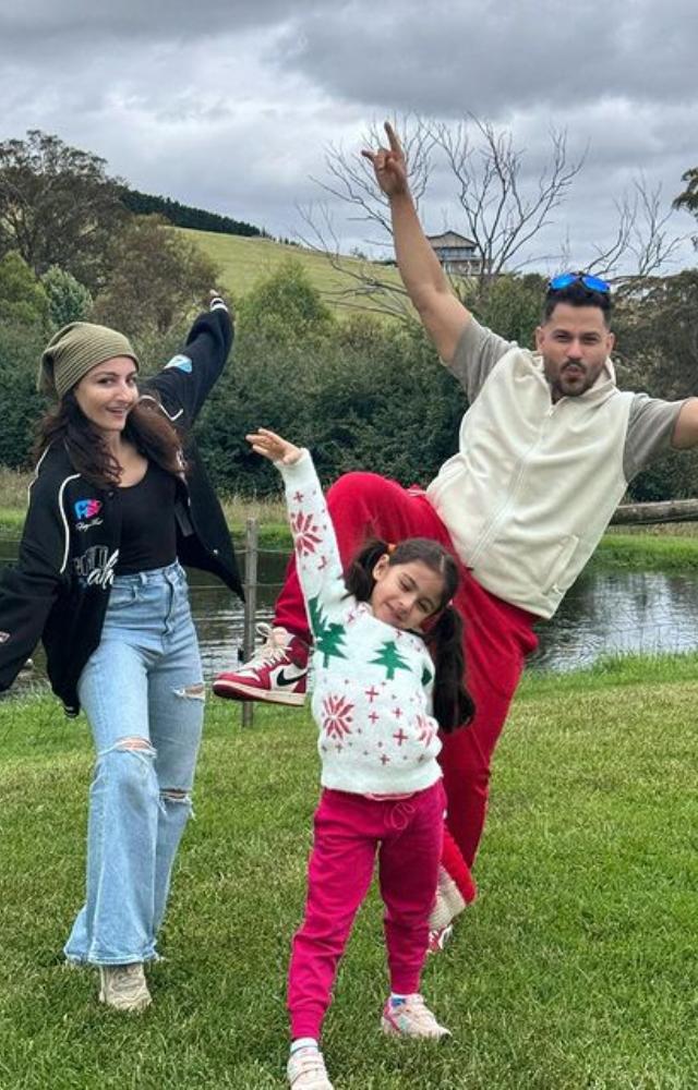 Soha Ali Khan and Kunal Kemmu produce endearing moments by adopting humorous stances that perfectly encapsulate the spirit of playfulness and family happiness.