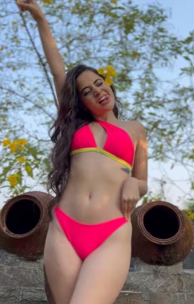 Urfi Javed shines in a pink bikini, exuding grace and style against the backdrop of the summer sun
