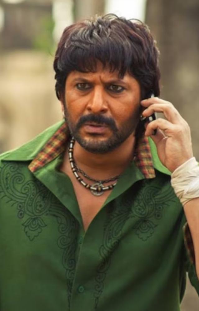 A raw, rugged character full of charm and mischief. Arshad blends humor and intensity in this memorable role.
