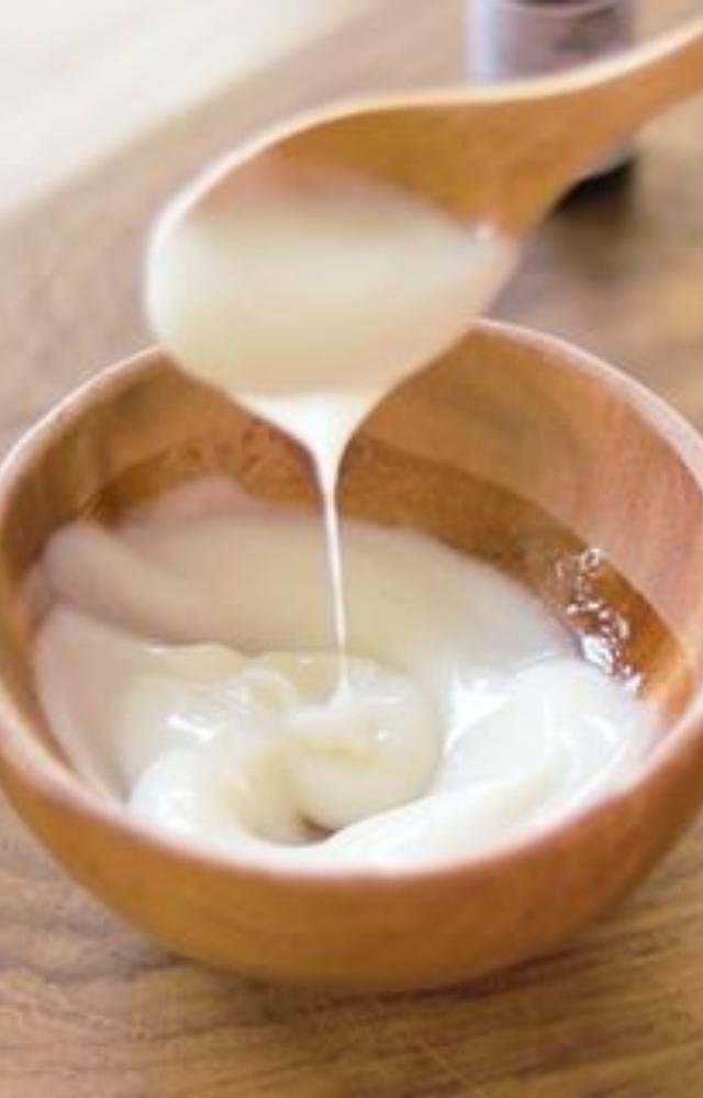 Blend warm coconut oil with curd. Deeply nourishes dry scalp, adds shine, and prevents split ends and breakage.
