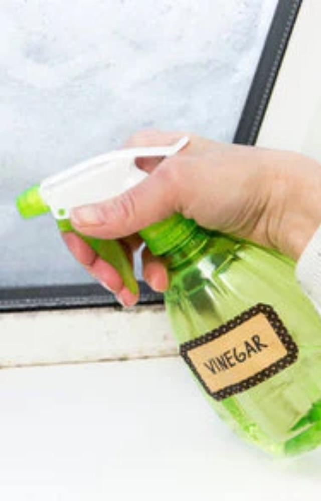 Use white vinegar and water in a spray bottle to get streak-free mirrors and windows. Say goodbye to cloudy reflections.