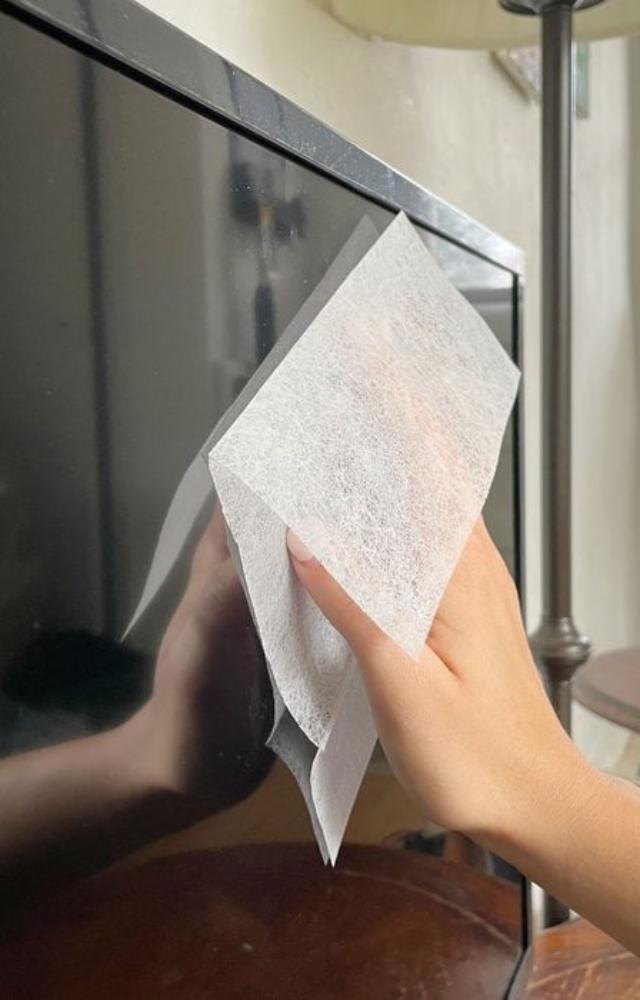 Wipe surfaces with dryer sheets to repel dust and keep furniture looking polished. Bonus: it leaves a pleasant scent too.
