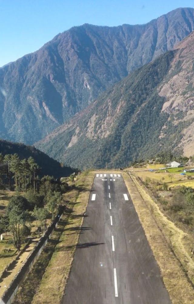 Perched between mountains with a super short runway—only elite pilots dare land here.
