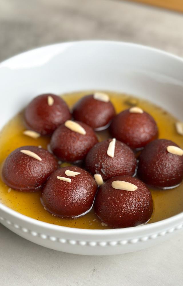 Soft, syrupy balls made from khoya and flavored with cardamom, a Diwali favorite.