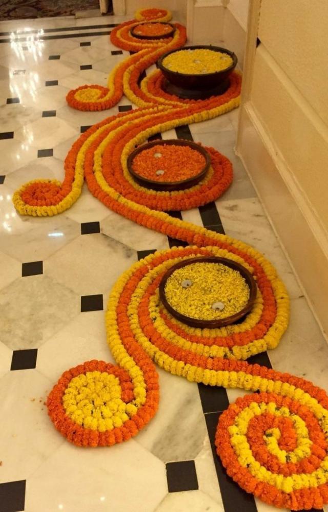 Create colorful rangoli designs with powders or flower petals, adding a vibrant touch to your home.
