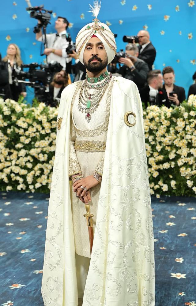 Diljit Dosanjh made a powerful Met Gala debut in a custom Prabal Gurung ensemble, exuding Punjabi royalty.