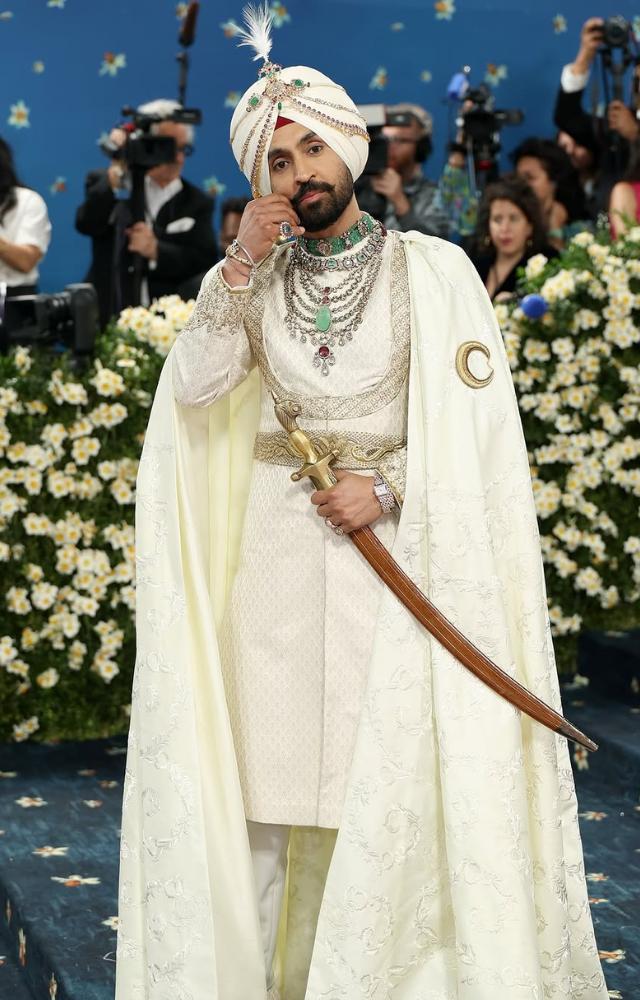 He carried a ceremonial sword, symbolizing Sikh valor and tradition, adding depth to his royal appearance.