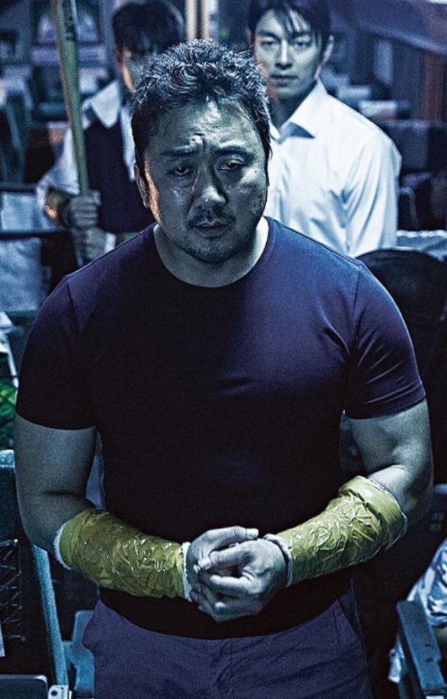 Don Lee takes on the role of a fearless hero, protecting his loved ones on a train overrun by zombies in this iconic thriller.