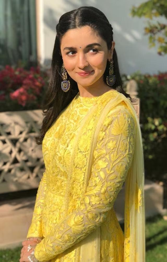 This bright yellow salwar suit screams confidence and charm. A cheerful pick for haldi or mehendi functions.
