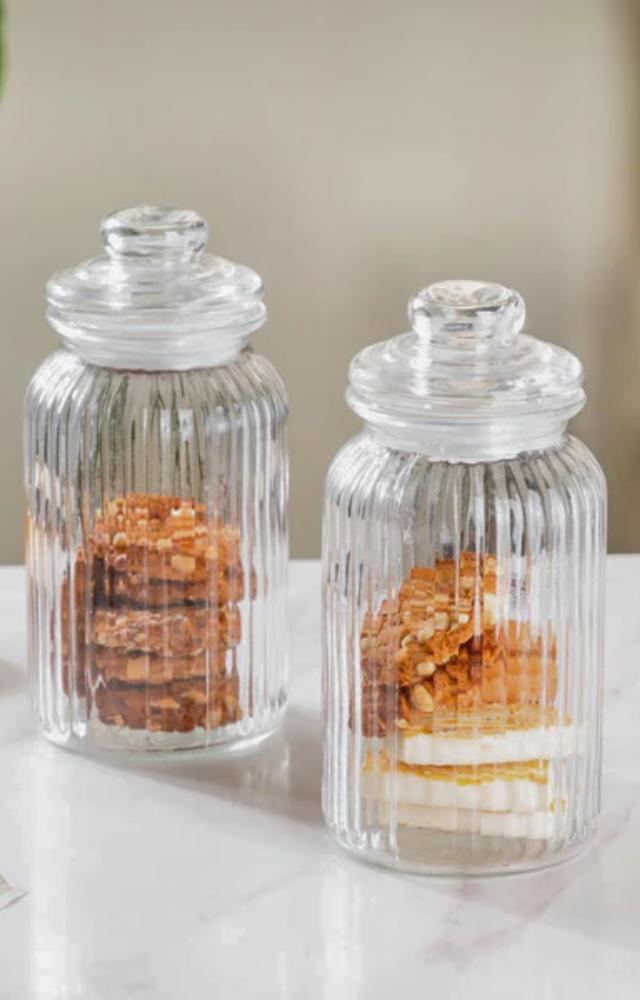 Empty pasta sauce or jam jars make perfect storage for spices, buttons, or even DIY candles. They’re sturdy, seal well, and look cute on shelves!

