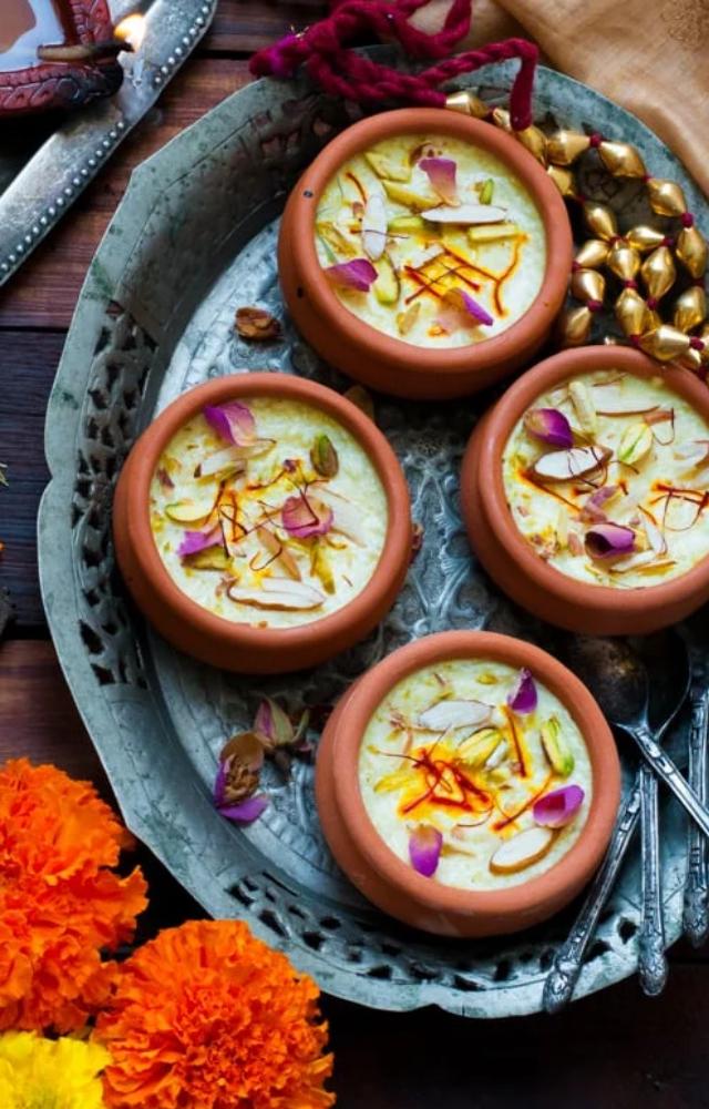 A creamy rice pudding flavored with cardamom and saffron. Garnish with nuts for a festive touch and serve it chilled for the perfect indulgence.