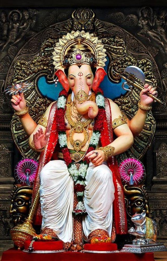The most iconic Ganpati in Mumbai, Lalbaugcha Raja, is adorned with gold and precious jewels, with its cost often estimated in crores.
