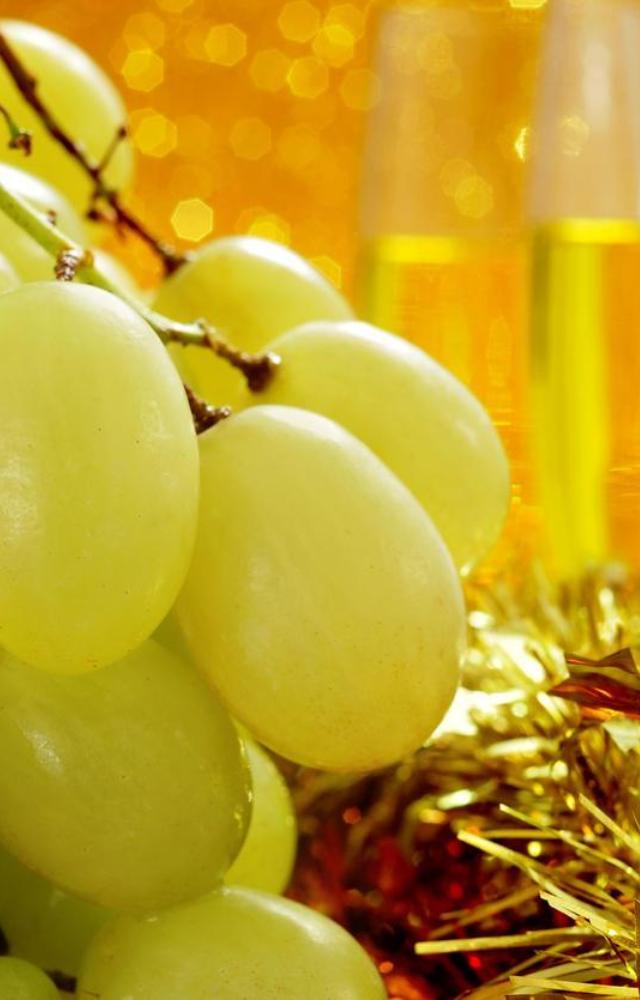 Believed to bring good luck, eating 12 grapes at midnight is a New Year’s tradition in Spain and other countries.
