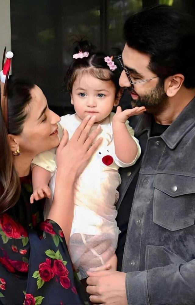 These pictures of Raha with her parents capture their deep love and affection on her special day.