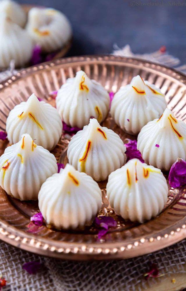 Steamed dumplings filled with jaggery and coconut, Modaks are Lord Ganesha`s favourite sweet and a festival staple.