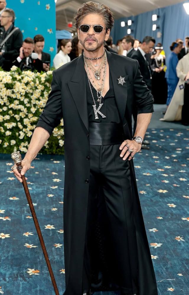 Shah Rukh Khan made a grand entrance at the 2025 Met Gala, embracing the theme “Tailored For You” with a custom ensemble by Sabyasachi Mukherjee.