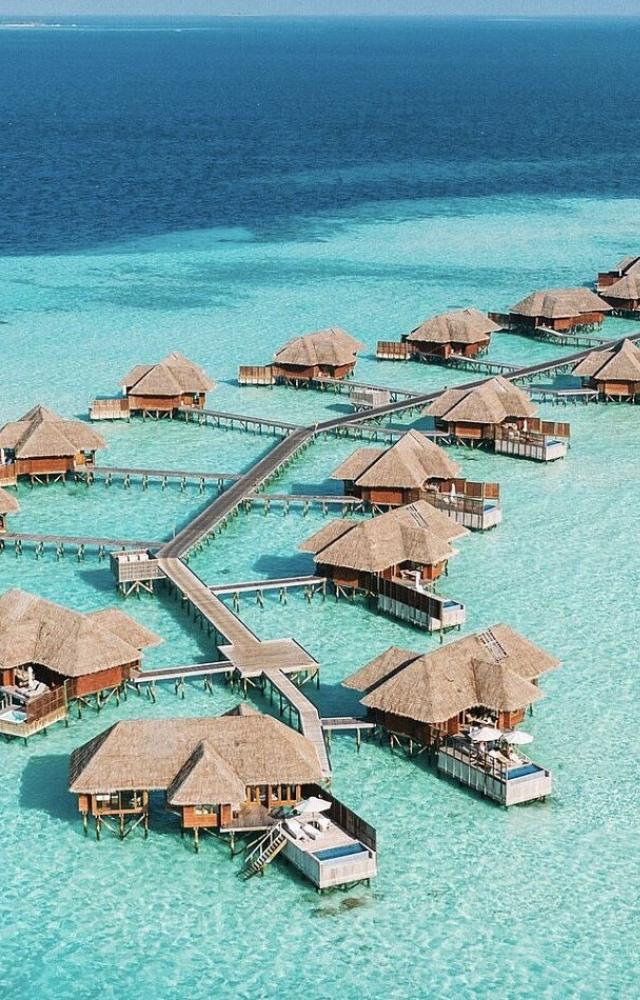Crystal-clear waters, white sand beaches, and luxurious overwater villas make the Maldives a top summer escape.