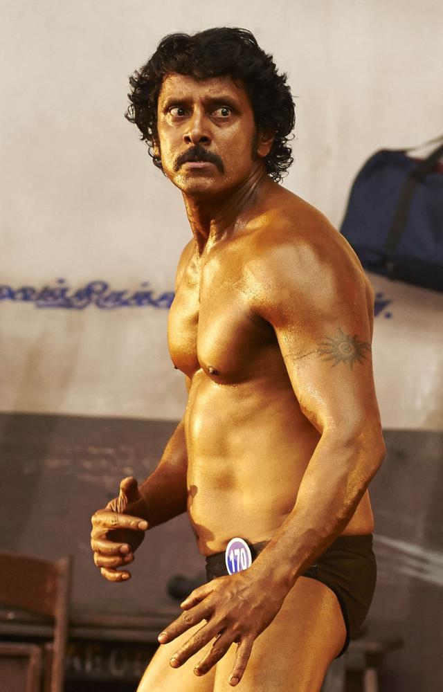 Vikram’s dedication shines in this epic transformation. He plays a bodybuilder turned disfigured model in a challenging dual role.