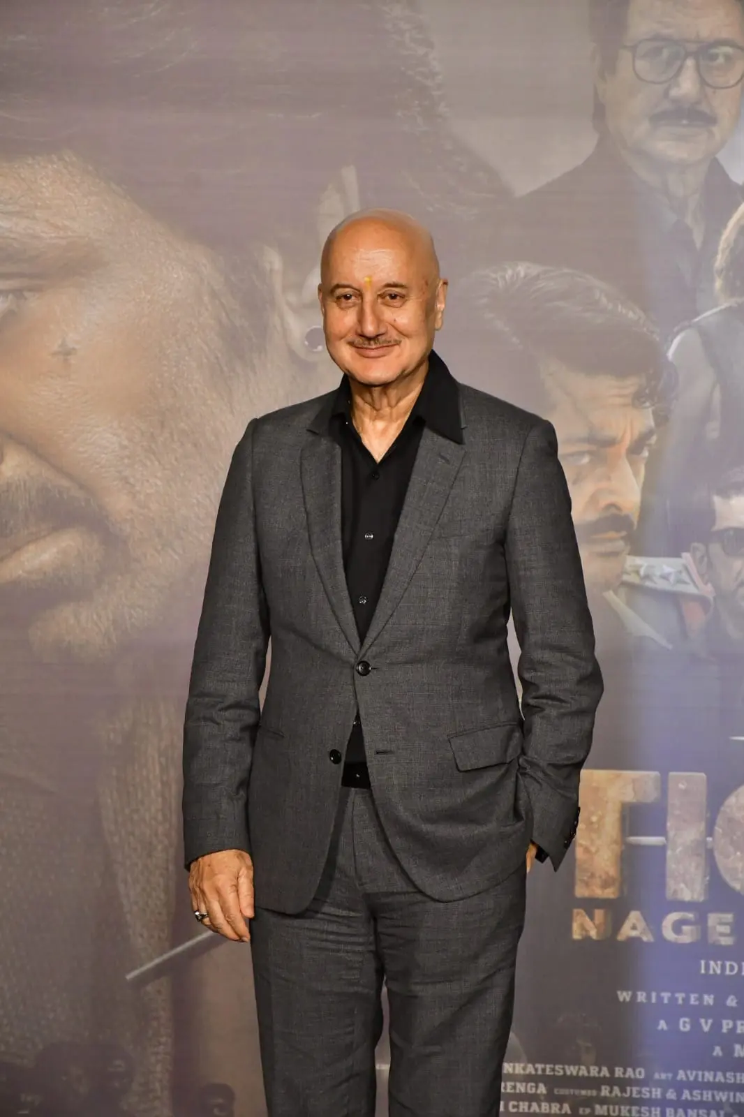 Anupam Kher posed for the paparazzi as he went for the trailer launch of his upcoming pan-India film `Tiger Nageswara Rao`