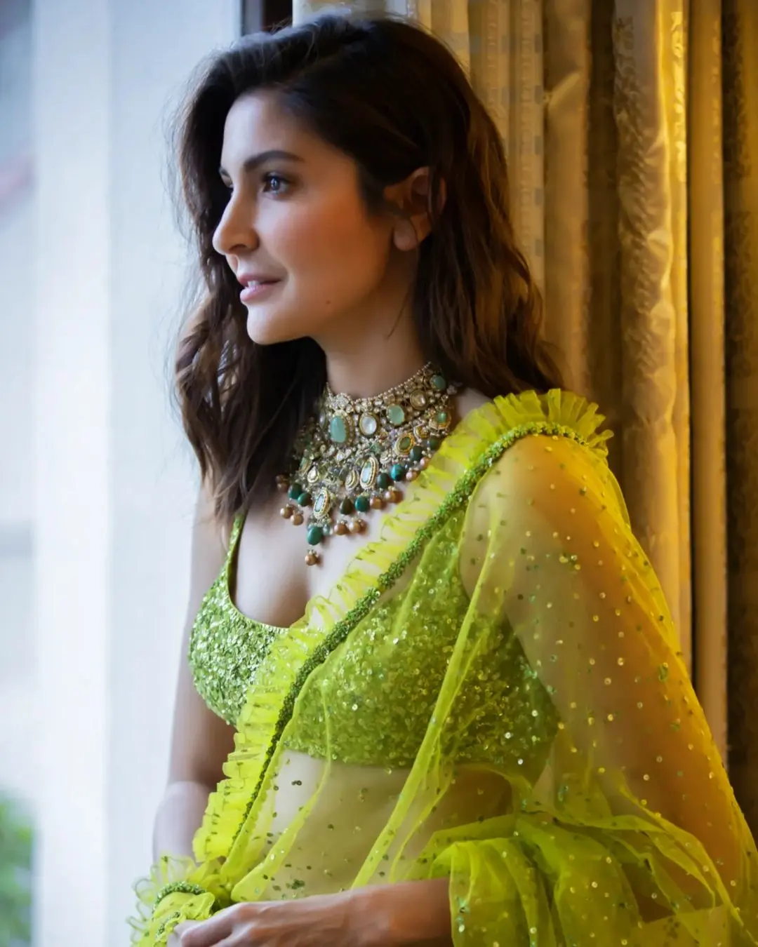 Are you attending a family function and feeling confused about what to wear? Then, why not choose this stunning green saree