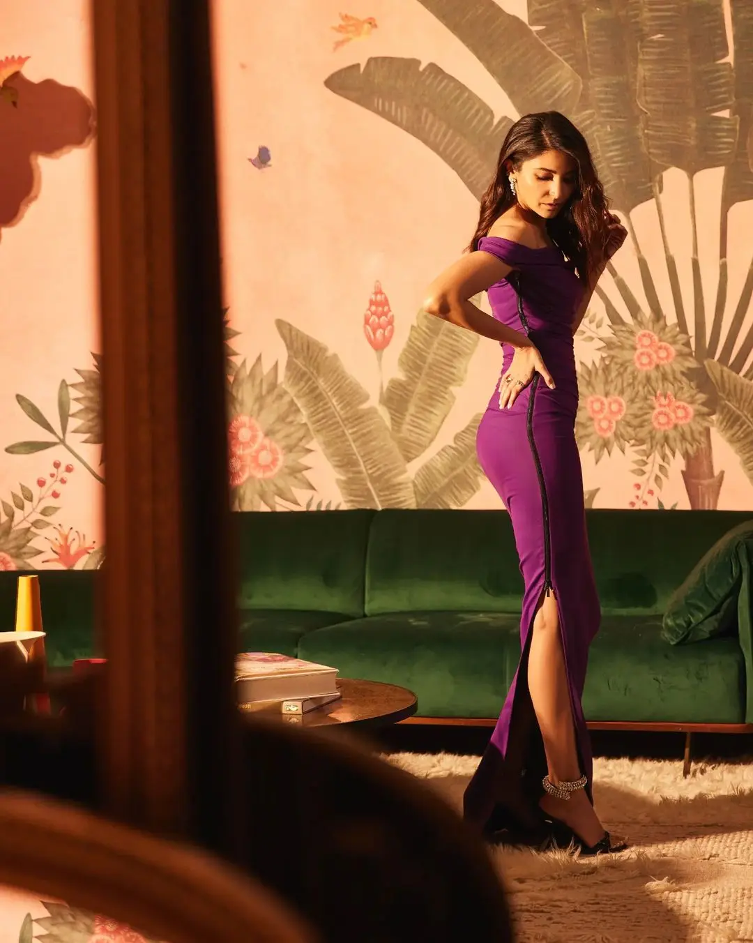 Anushka Sharma reflected everything royal in a midnight purple gown and the thigh-high slit paired with heels with a bling