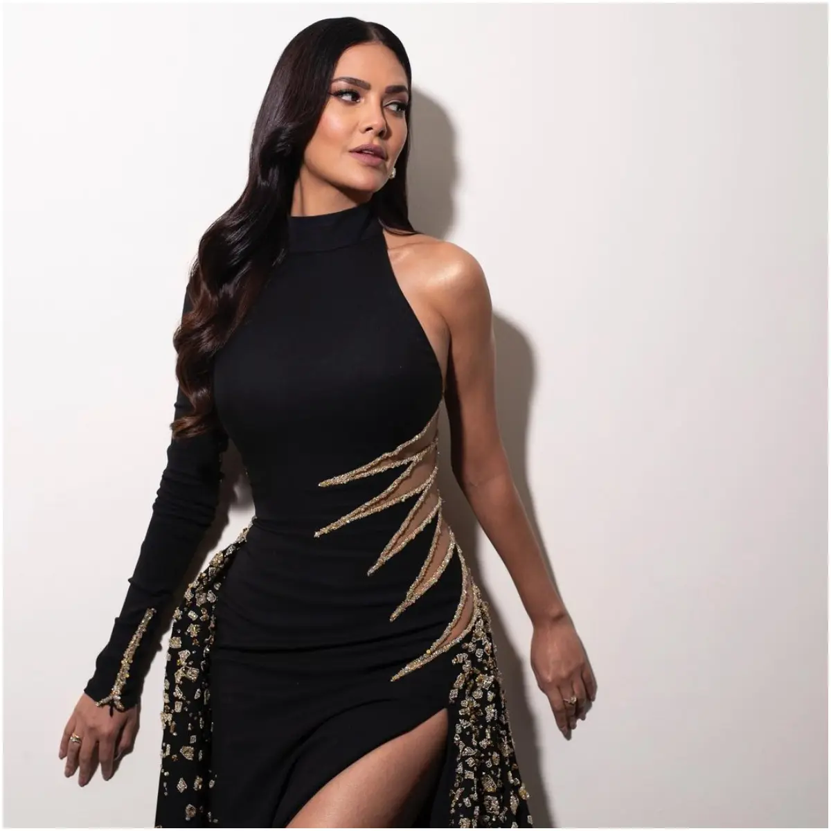 Black really is Esha`s colour. The actress attended an awards event earlier this year wearing this stunning black dress with golden detailing