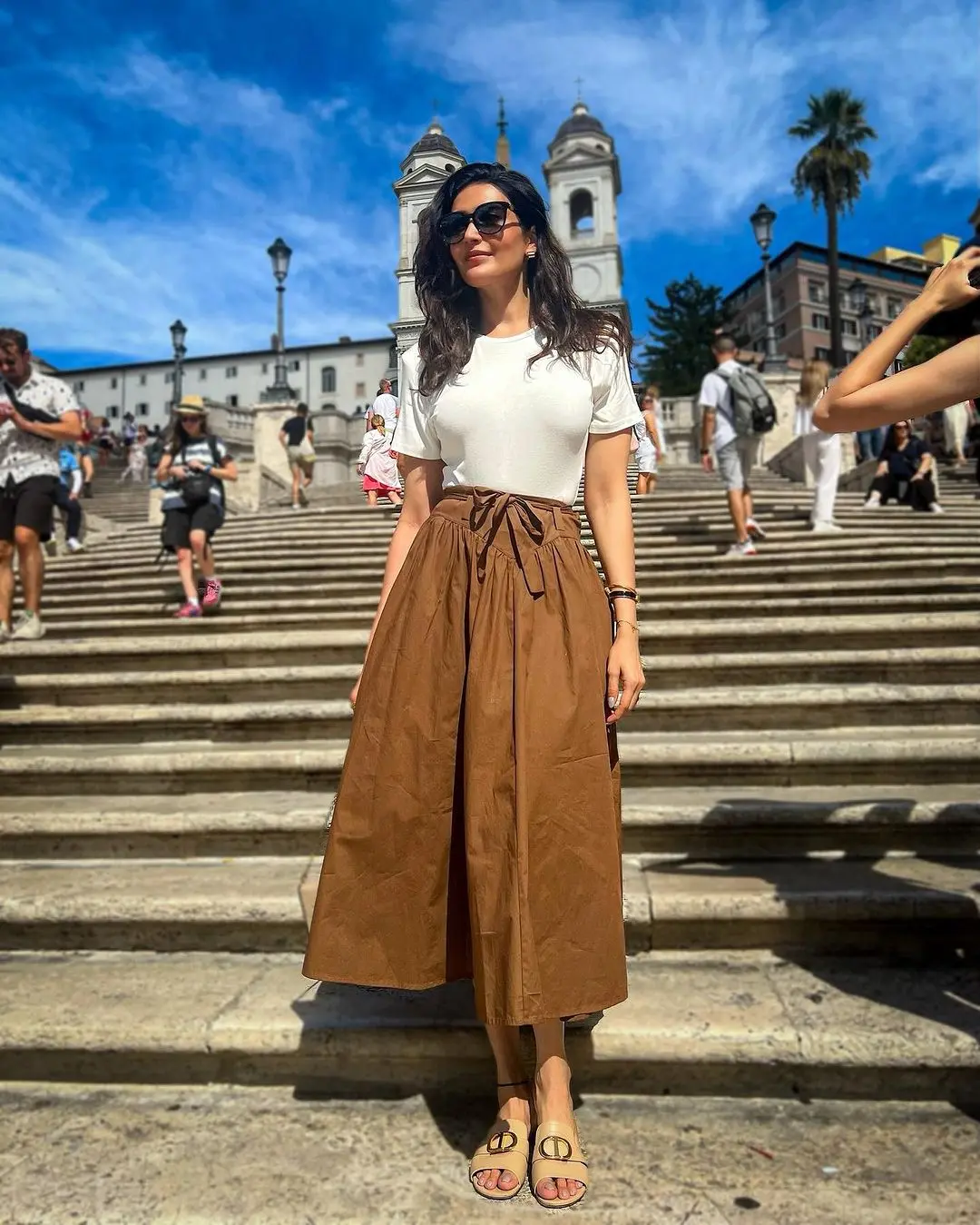There are days when we don`t feel like putting a lot of effort into our outfits, especially when it comes to our office look. Karishma Tanna`s brown palazzo pants paired with a white top offer a simple yet stylish solution that can be a perfect choice for such occasions