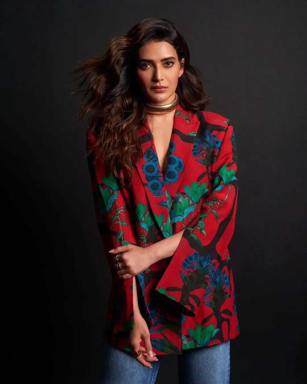 Karishma further enhanced her look by styling her hair in elegant curls, which added a touch of sophistication and glamour to her overall appearance. To elevate her entire ensemble, the actress incorporated interesting and chic jewellery