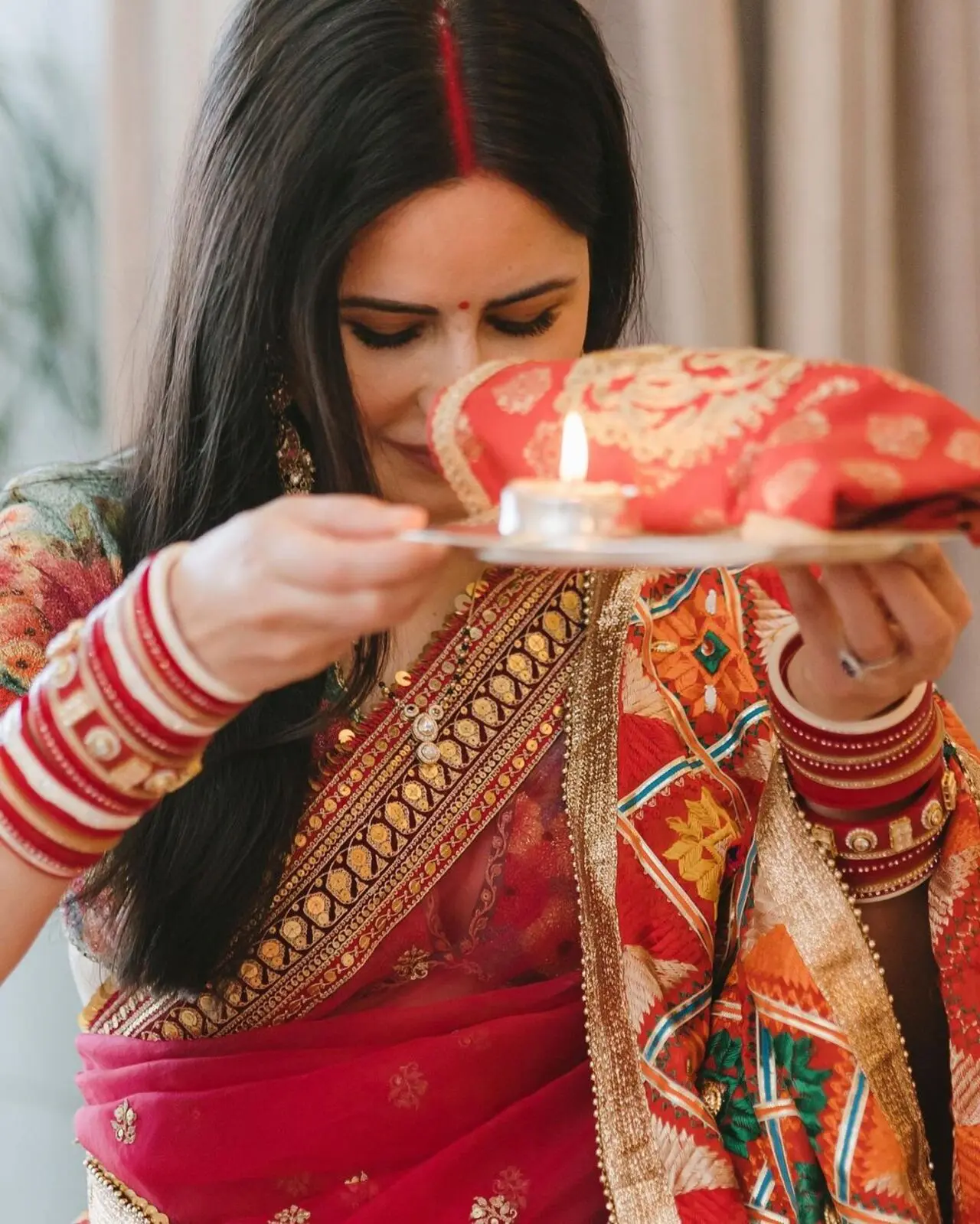 The actress shared pictures of her first Karva Chauth celebration. She wore a matching bindi on her forehead and looked beautiful