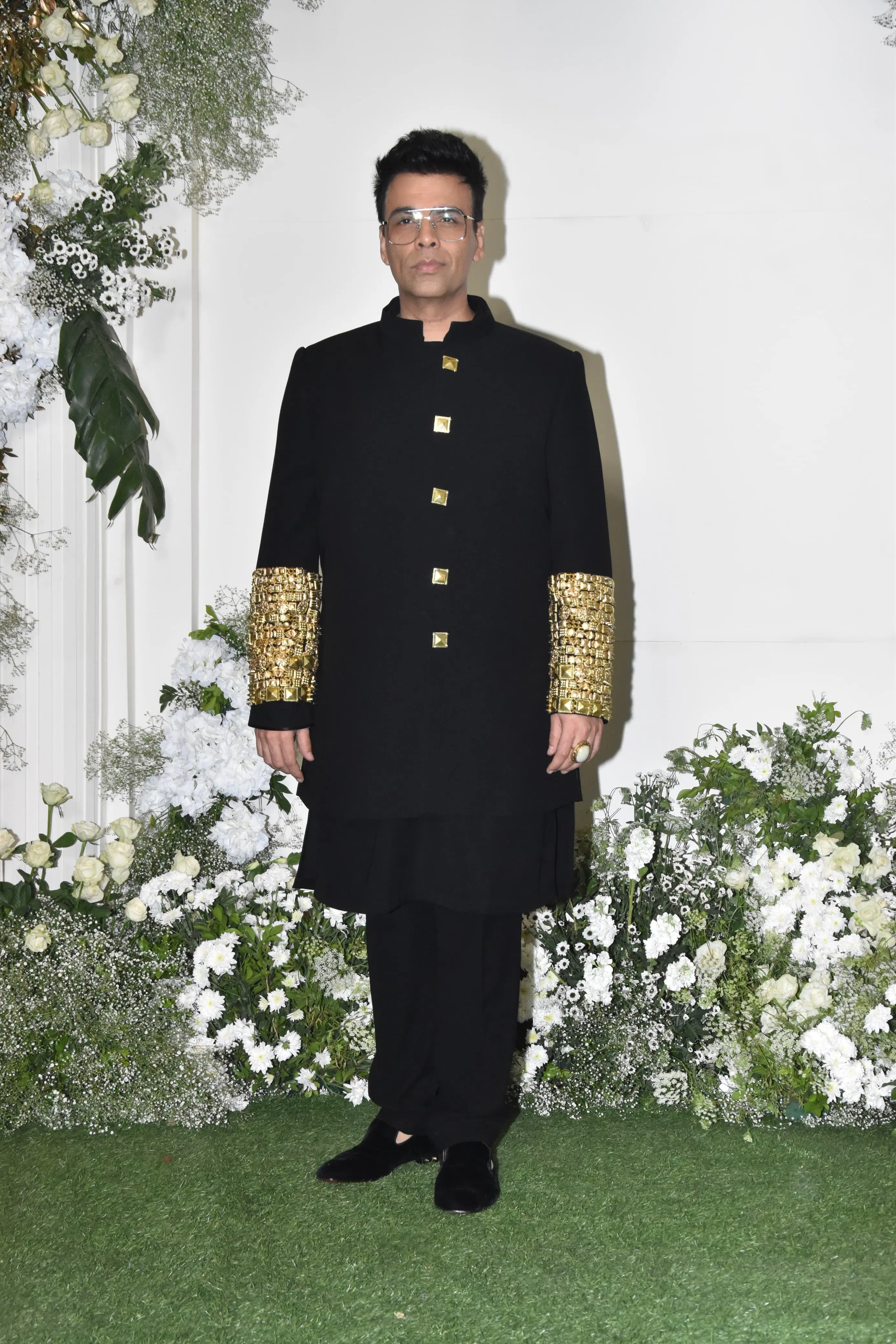 Ace director Karan Johar attended the party wearing a sherwani suit adorned with intricate golden embroidery on the sleeves.