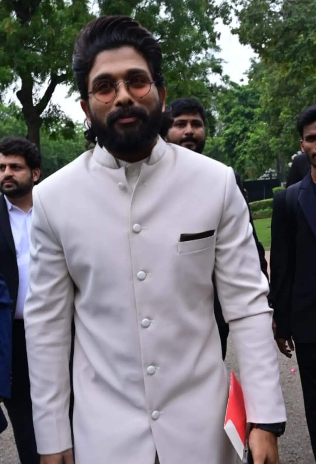 Allu Arjun looked dashing as he chose a white button-up suit to attend the grand ceremony