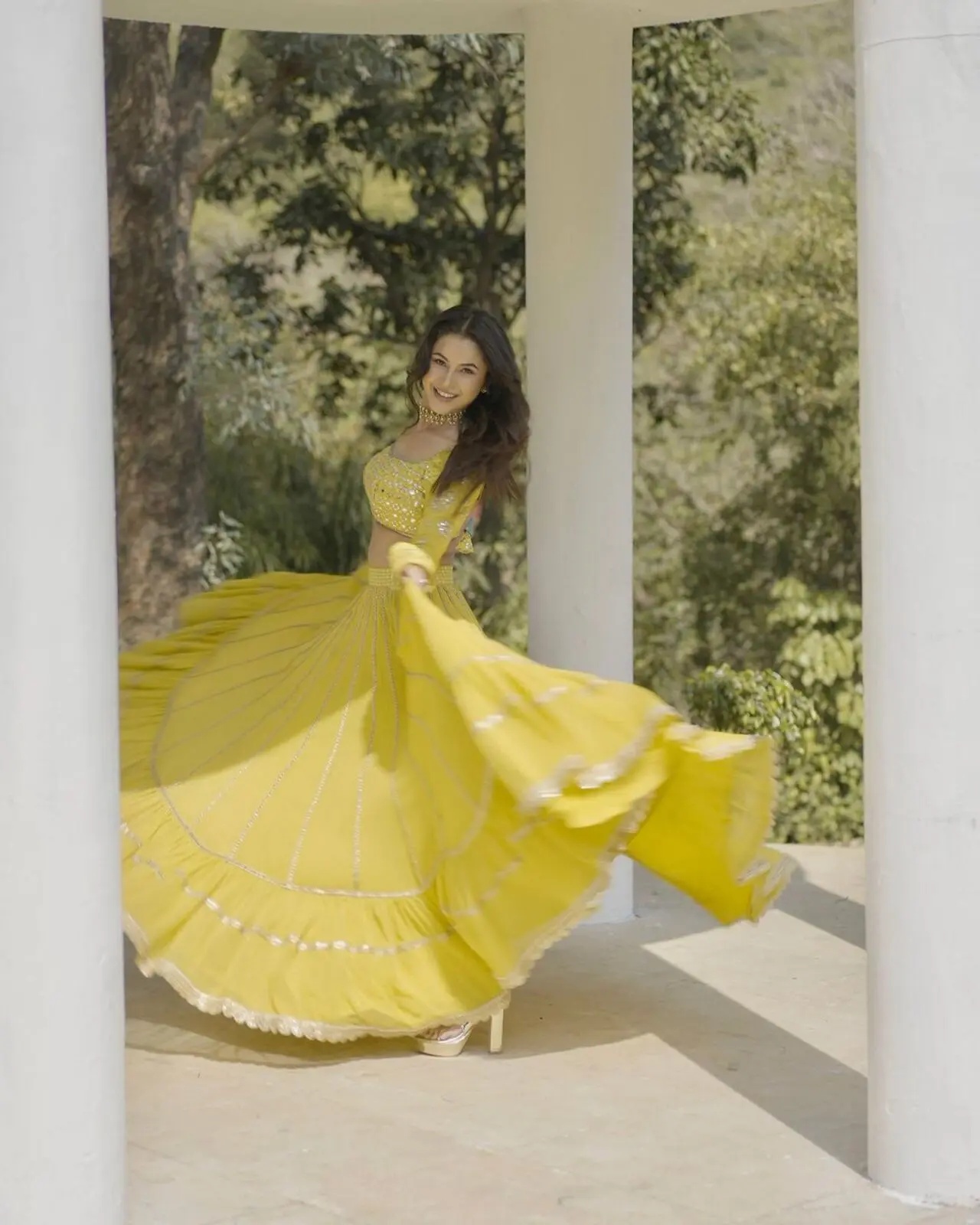 Shehnaaz wore a vibrant yellow lehenga. It can be on your list too for the Navratri celebration on the 4th day. It`s a perfect garba outfit