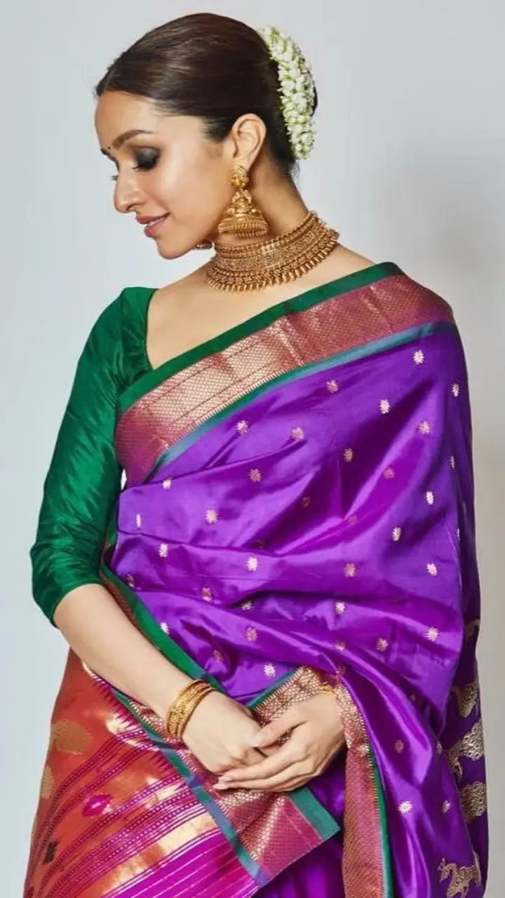 Shraddha Kapoor wore her mother Shivangi Kapoor`s purple paithani saree. With her hair done in a neat bun and adorned with gajra, the actress looked breathtakingly beautiful