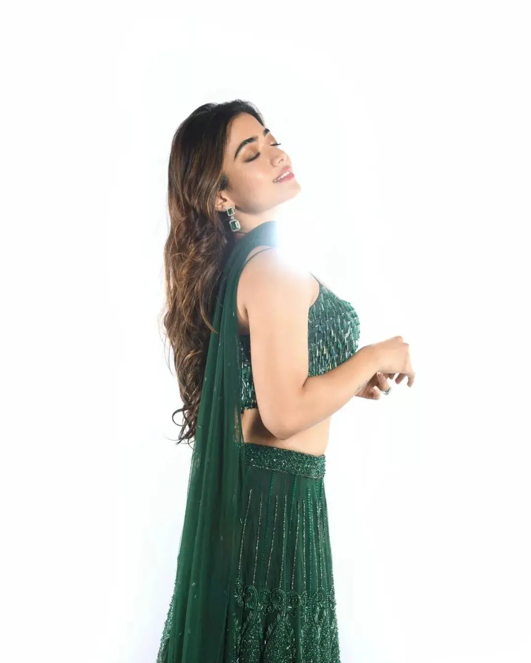 This Diwali give yourself a chance to shine and choose Rashmika Mandanna`s stunning, heavily embroidered green lehenga set