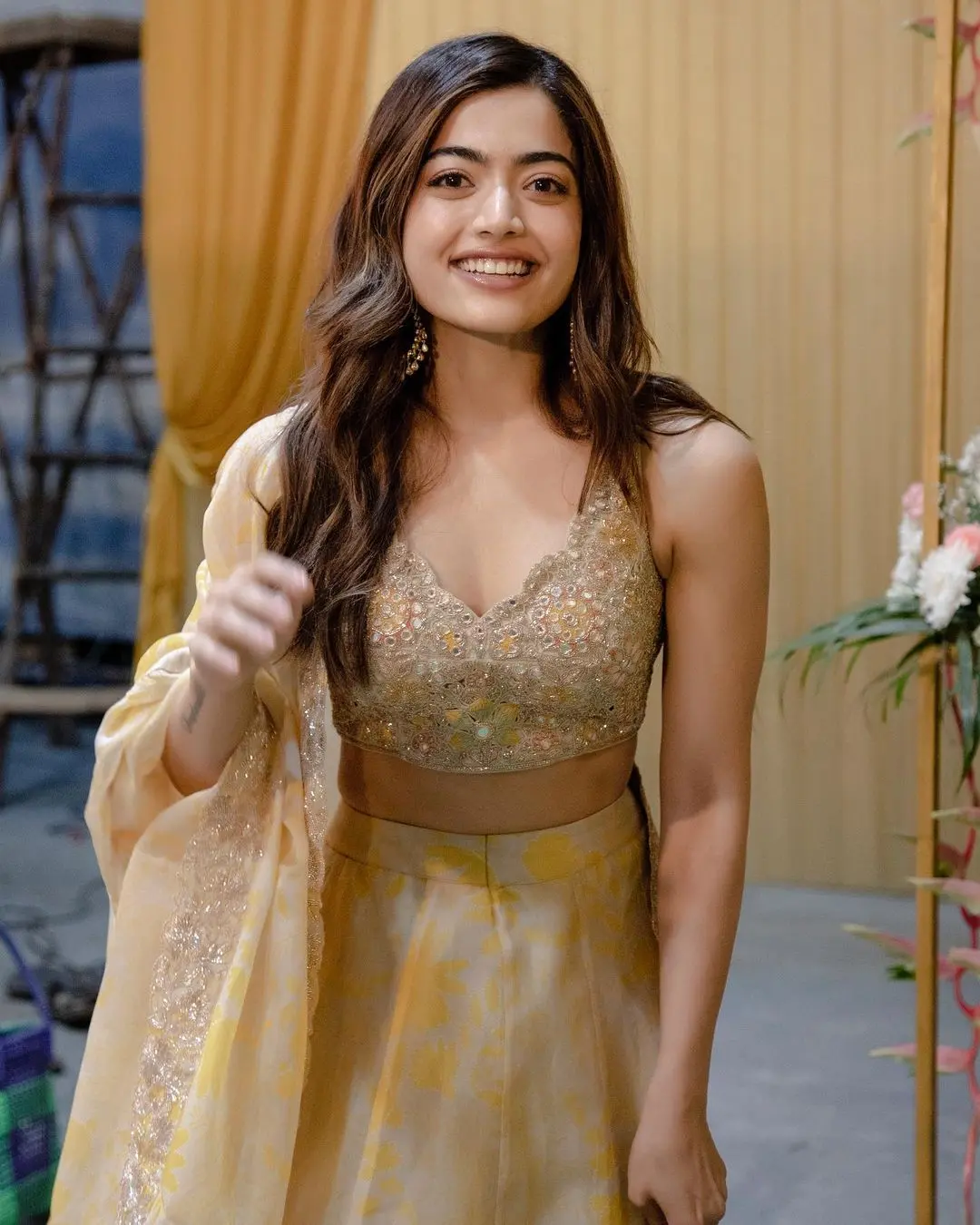 In this look, Rashmika chose a lime-colored lehenga paired with a heavily embroidered, golden blouse. The simple lehenga balanced the heavy blouse, creating subtleness in the actress` overall appearance