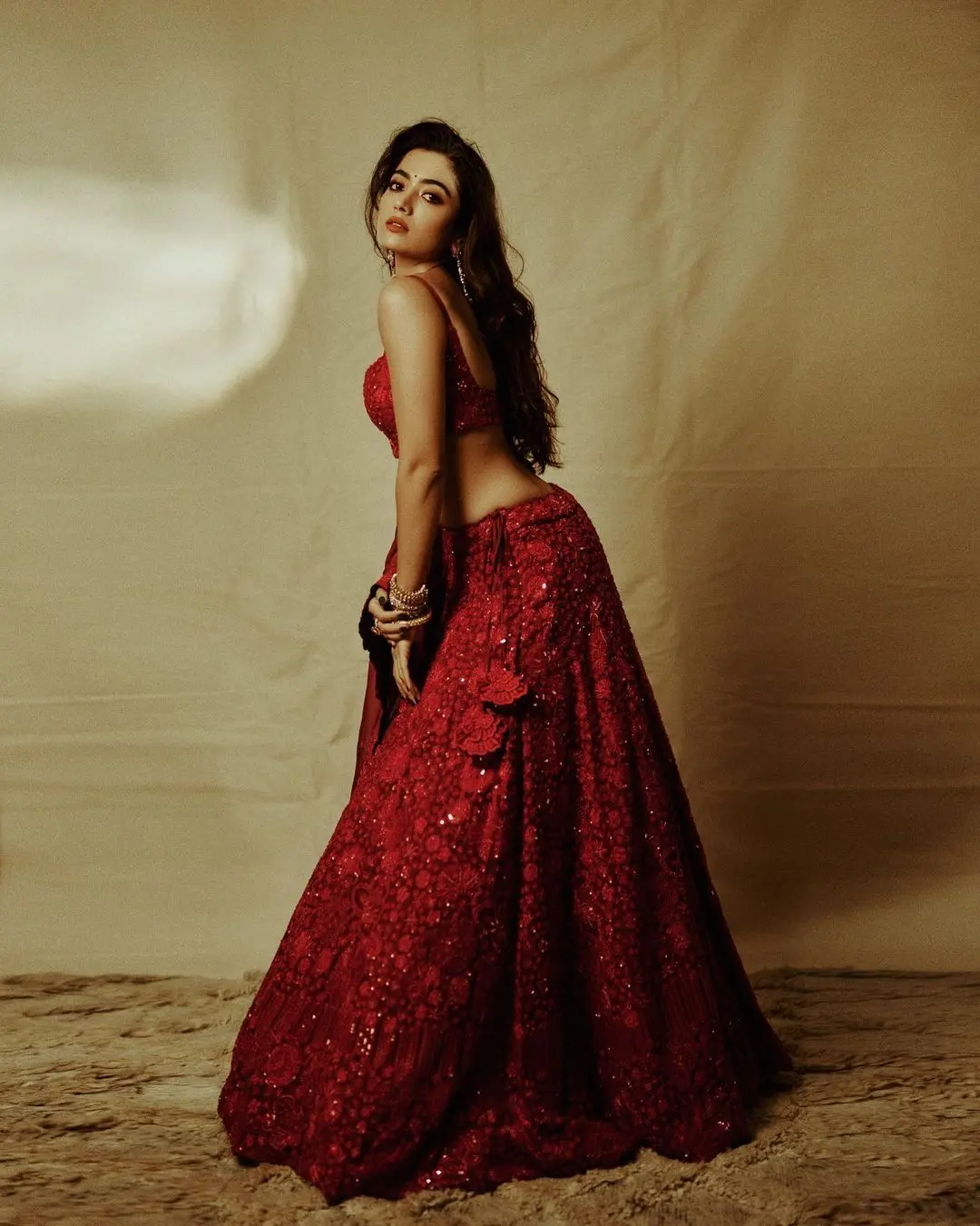 If you want to stand out, then look no further and wear this all-red lehenga. The stunning red color and the simplicity on Rashmika`s face steal hearts