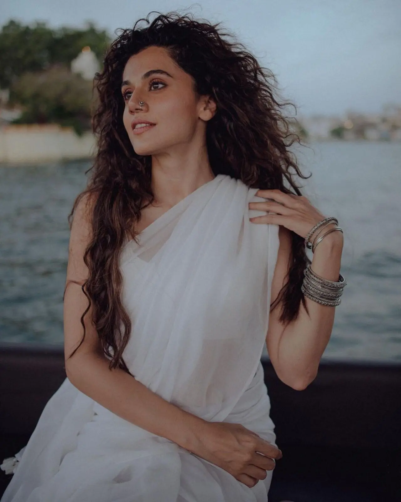 Taapsee Pannu reflected everything royal in a stunning white saree. The actress resembled a fairy with her hair left open in deep curls